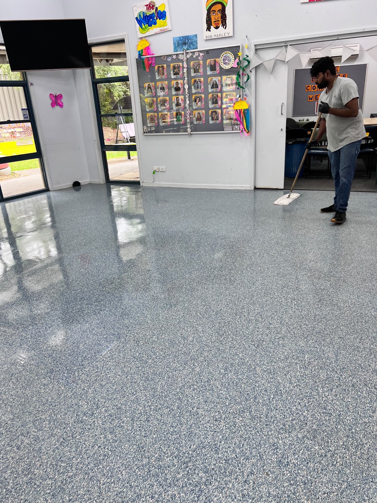 Same hard floor after strip and seal, restored to a high-gloss finish